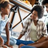 Parents having serious conversation with teenage child with problem solving attitude