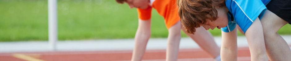 Two boys at the start line of a race