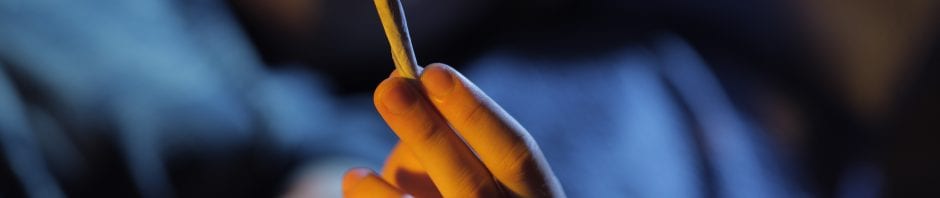 teen holding marijuana joint